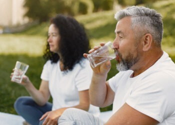 couple drinking water outdoors 1