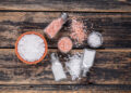 Sea salt and Himalayan salt in bowls and shakers, illustrating 'Celtic Salt vs Himalayan Salt' comparison